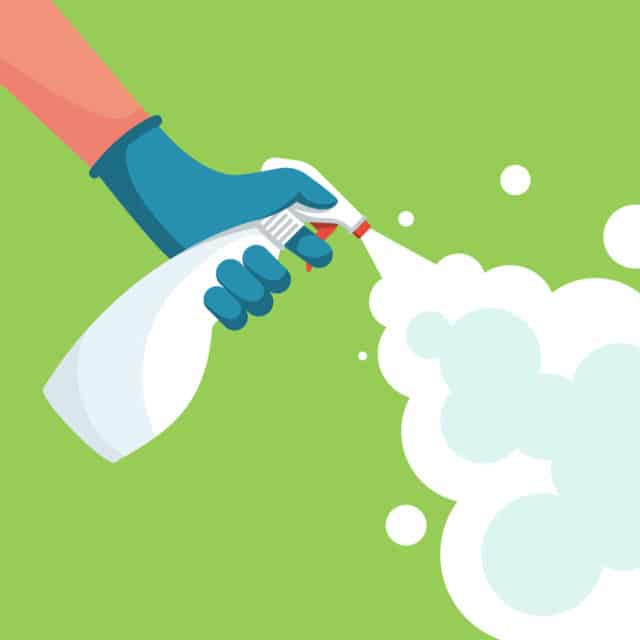 Hand with spray bottle coming out of spray cloud in comic style